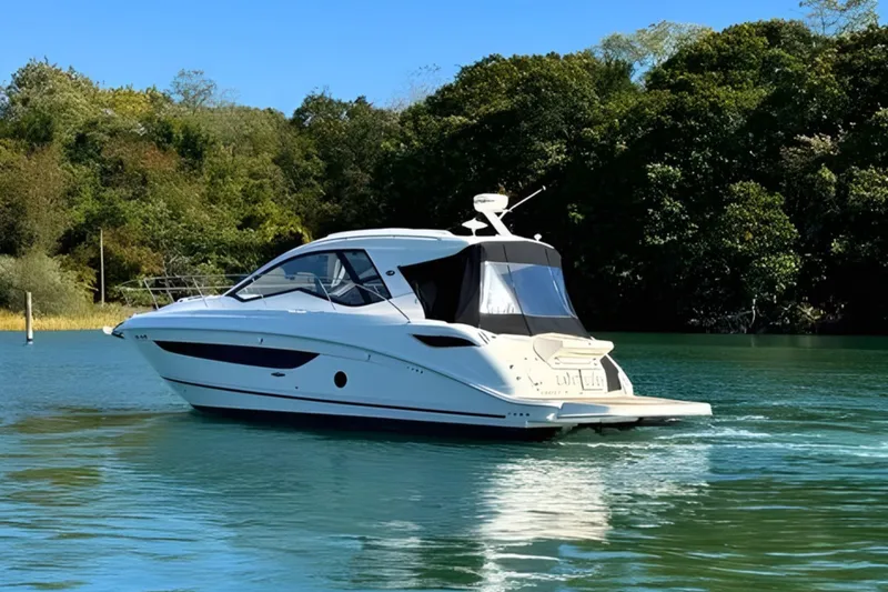 Slide: The Image of 2017 Sea Ray Sundancer 350 Coupe cruising on a serene lake with lush greenery. - 1