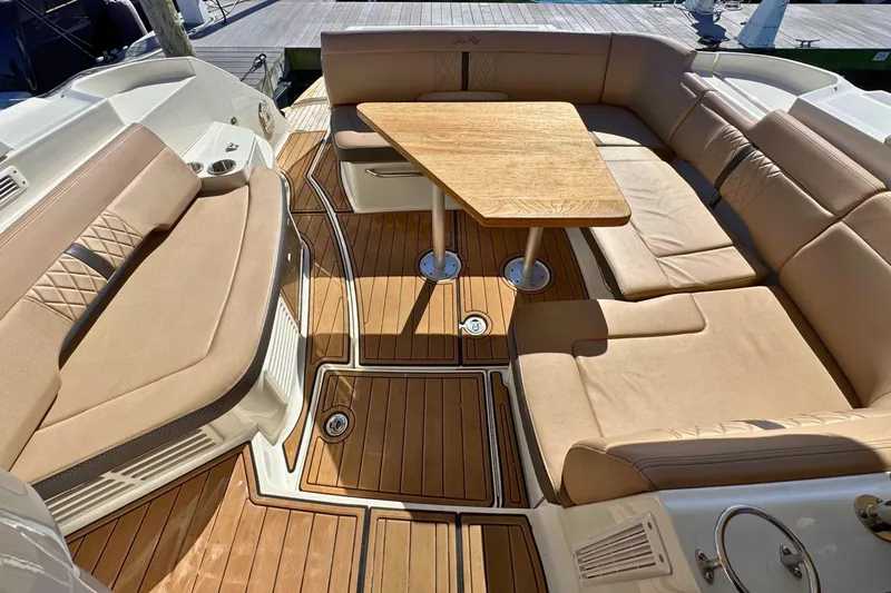 Slide: The Image of Luxurious seating area on 2017 Sea Ray Sundancer 350 Coupe yacht with wooden table. - 13