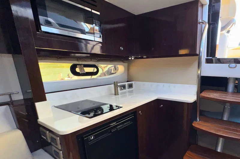 Slide: The Image of Luxurious 2017 Sea Ray Sundancer 350 Coupe yacht kitchen with modern appliances and sleek design. - 18