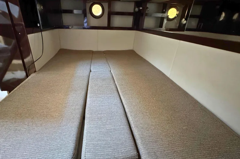 Slide: The Image of Interior cabin of 2017 Sea Ray Sundancer 350 Coupe with beige upholstery. - 21