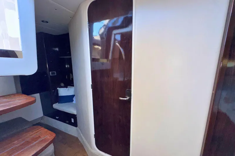 Slide: The Image of Interior of 2017 Sea Ray Sundancer 350 Coupe with wooden door and seating area. - 22