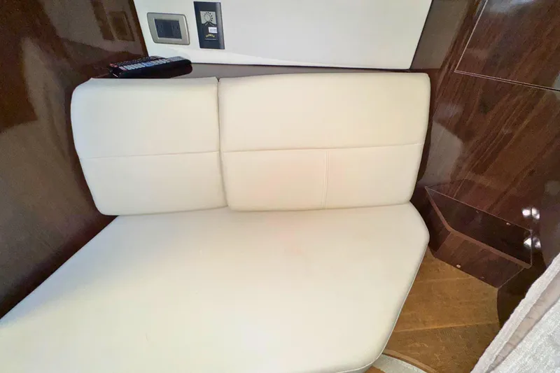 Slide: The Image of Interior seating of 2017 Sea Ray Sundancer 350 Coupe with beige upholstery. - 27