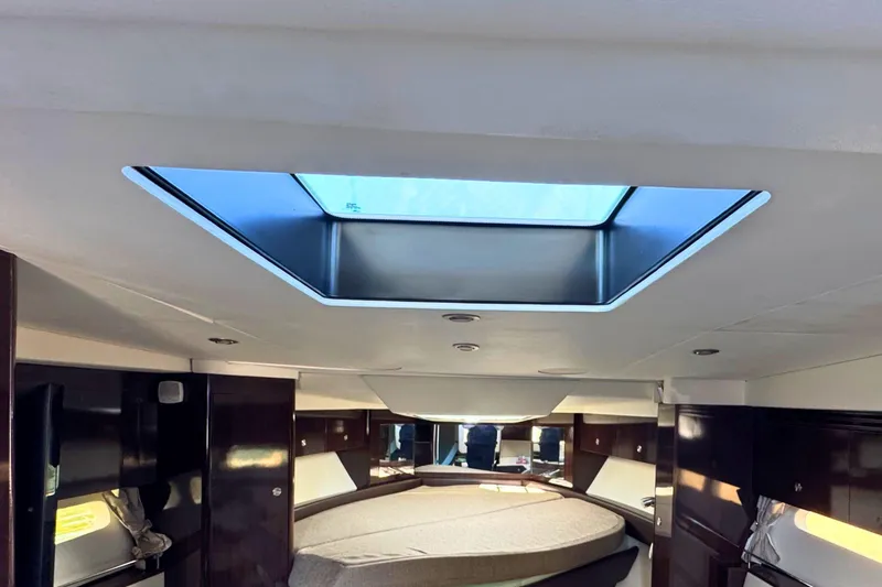 Slide: The Image of Interior of 2017 Sea Ray Sundancer 350 Coupe with skylight and luxurious cabin. - 29