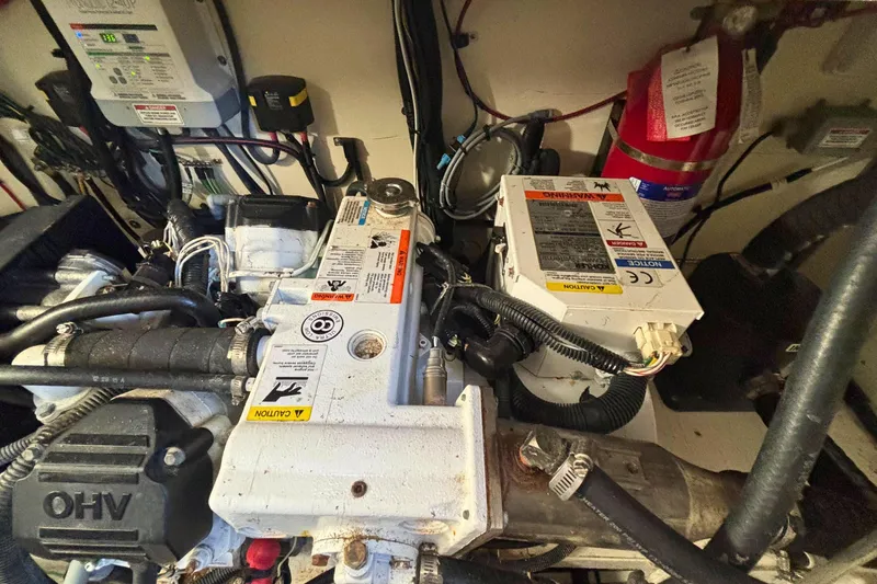 Slide: The Image of Engine room of 2017 Sea Ray Sundancer 350 Coupe with visible components and wiring. - 33