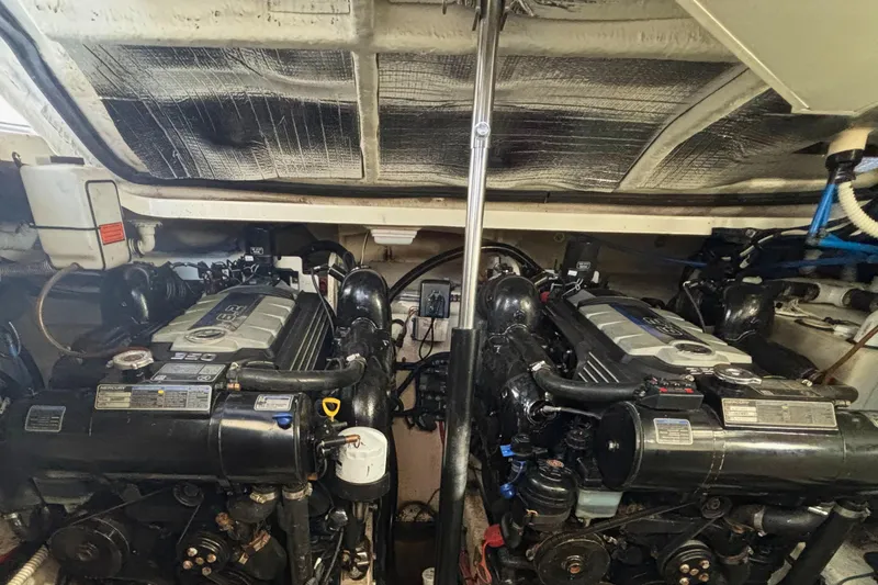 Slide: The Image of Engine compartment of a 2017 Sea Ray Sundancer 350 Coupe with dual engines. - 34