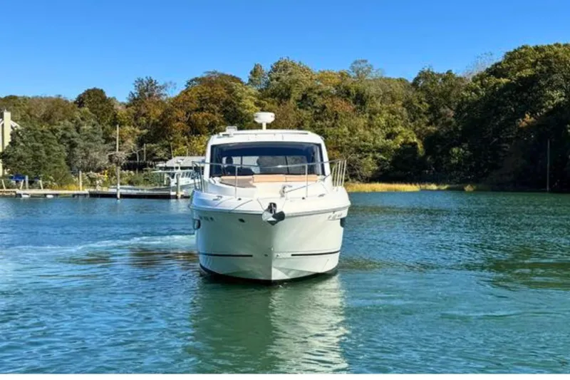 Slide: The Image of 2017 Sea Ray Sundancer 350 Coupe cruising on a serene lake. - 6