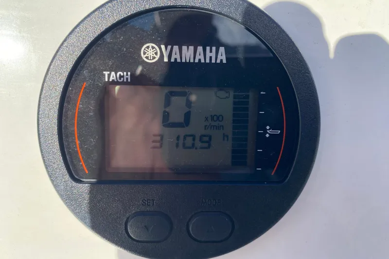 Slide: The Image of Garmin marine radio on 2019 Brig Eagle 650 boat, featuring distress button and control knobs. - 10