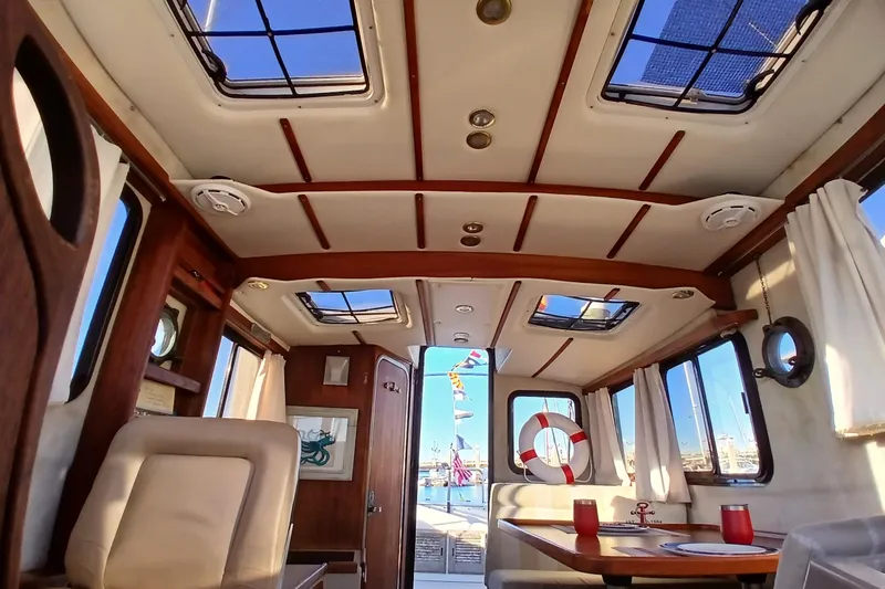 Slide: The Image of Interior of 2009 Ranger Tugs R-25 boat with skylights and dining area. - 11