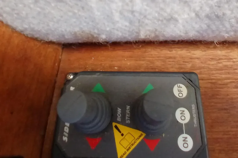 Slide: The Image of Control panel for thrusters on 2009 Ranger Tugs R-25 boat. - 31