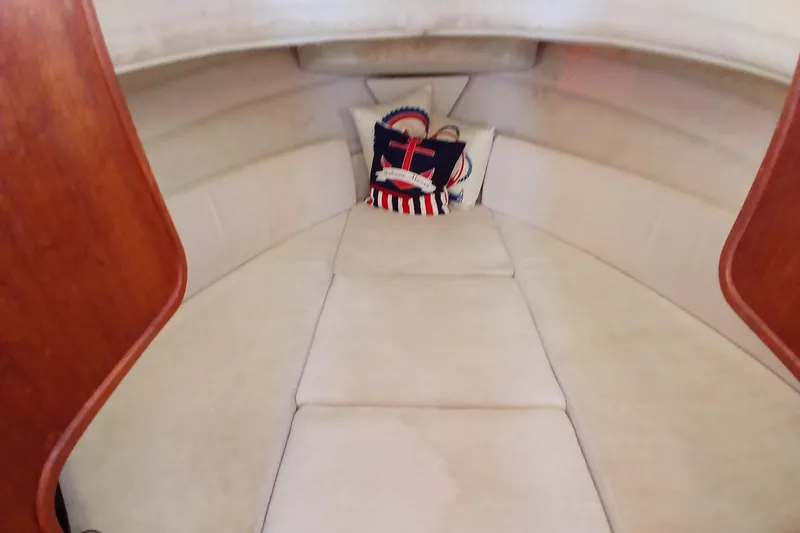 Slide: The Image of 2009 Ranger Tugs R-25 cabin interior with nautical-themed cushions. - 37