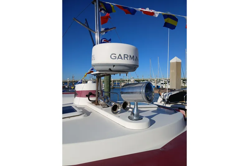 Slide: The Image of 2009 Ranger Tugs R-25 boat with Garmin radar and nautical flags in marina. - 49