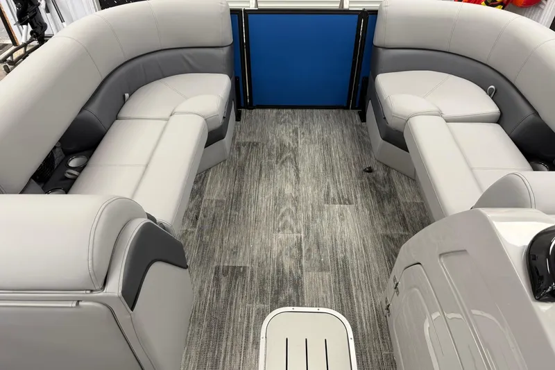 Slide: The Image of 2026 Bentley Pontoons Elite 223 Swingback interior with gray seating and wood-style flooring. - 3