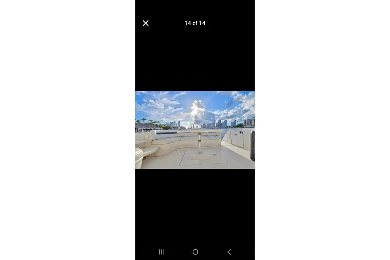 Slide: The Image of 2006 Sea Ray 500 Sundancer yacht deck with city skyline view. - 3