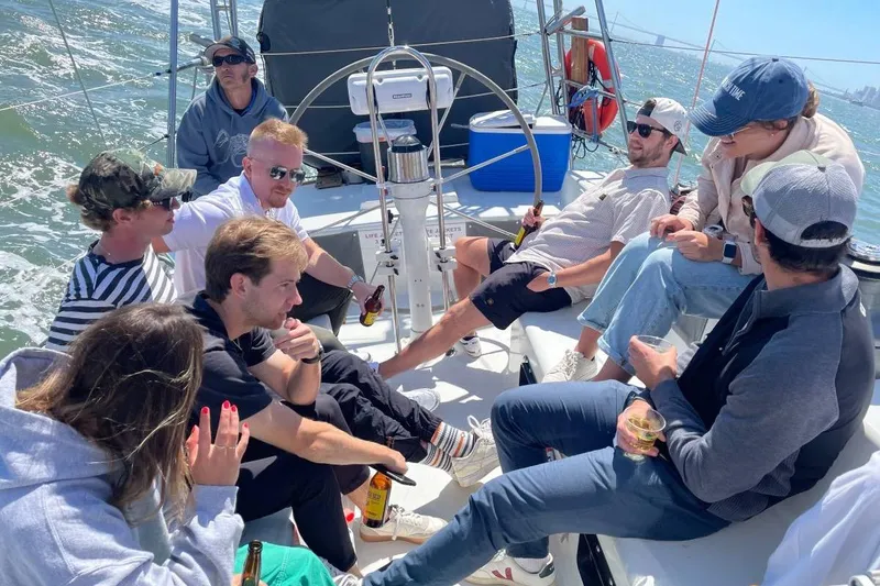 Slide: The Image of Group enjoying a sunny day on a 1982 Santa Cruz 50 sailboat. - 17