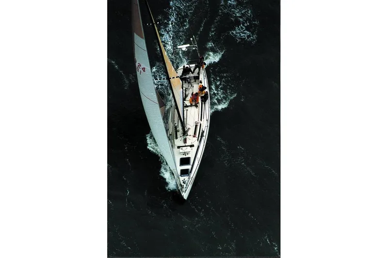 Slide: The Image of Overhead view of 1982 Santa Cruz 50 sailboat navigating through dark waters. - 21