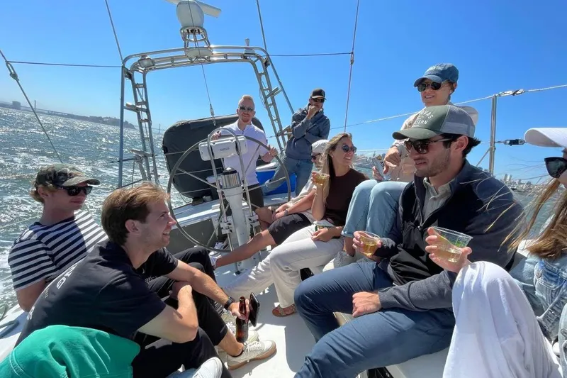 Slide: The Image of Group enjoying a sunny day on a 1982 Santa Cruz 50 sailboat. - 24