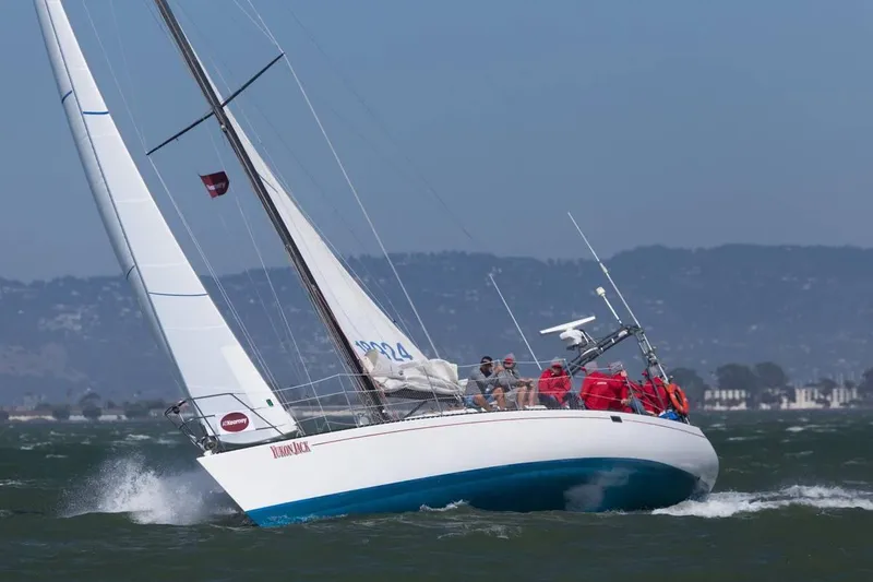 Slide: The Image of Sailing yacht Santa Cruz 50, 1982 model, navigating choppy waters with crew on deck. - 4