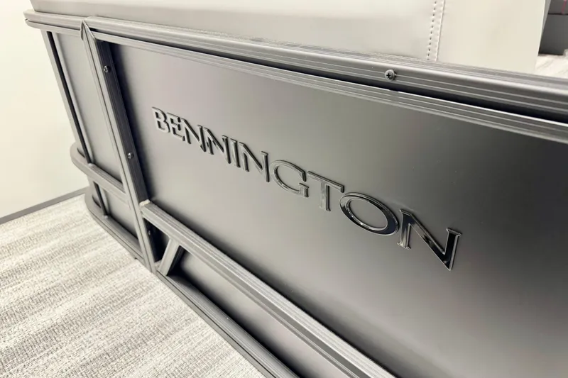 Slide: The Image of 2026 Bennington 20S Cruise interior with gray and red seating in a showroom. - 5