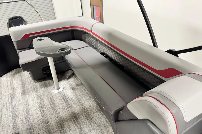 Slide: The Image of 2026 Bennington 20S Cruise boat seating with gray and red upholstery. - 7