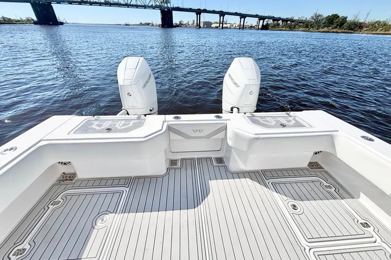 Slide: The Image of Custom HHH 35LX Catamaran 2020 with twin Mercury engines on a calm river. - 20