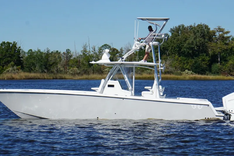 Slide: The Image of Custom HHH 35LX Catamaran 2020 on water, featuring elevated helm and sleek design. - 3