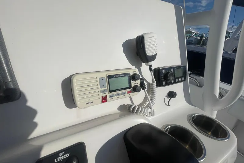 Slide: The Image of Control panel of a 2013 Tidewater 210 LXF boat with communication devices. - 16