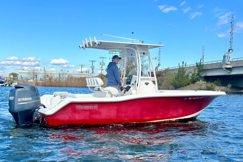 Slide: The Image of 2013 Tidewater 210 LXF boat with Yamaha engine on a sunny day. - 7
