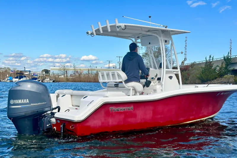 Slide: The Image of 2013 Tidewater 210 LXF boat with Yamaha engine on a sunny day. - 8