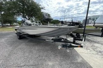 The Image of 2020 Tracker Pro Team 195 TXW Tournament Edition boat on trailer in parking lot. - 0