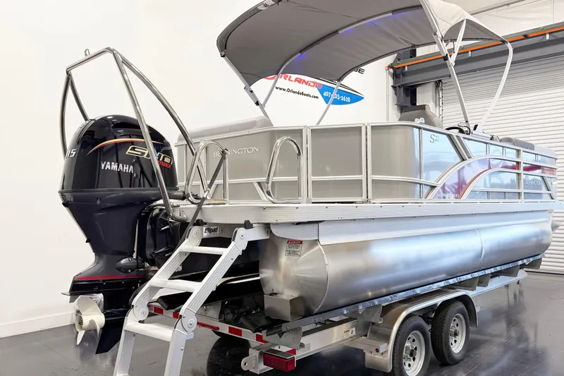 Slide: The Image of 2025 Bennington 21S Cruise pontoon boat with Yamaha engine on trailer. - 12