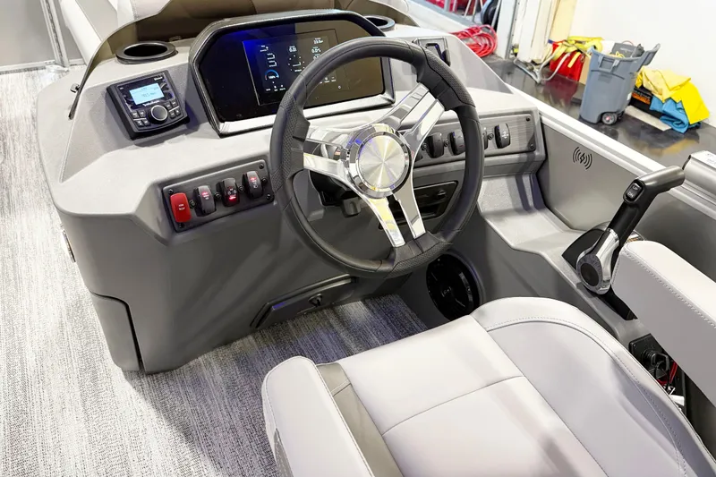 Slide: The Image of 2025 Bennington 21S Cruise boat interior with modern steering wheel and control panel. - 8
