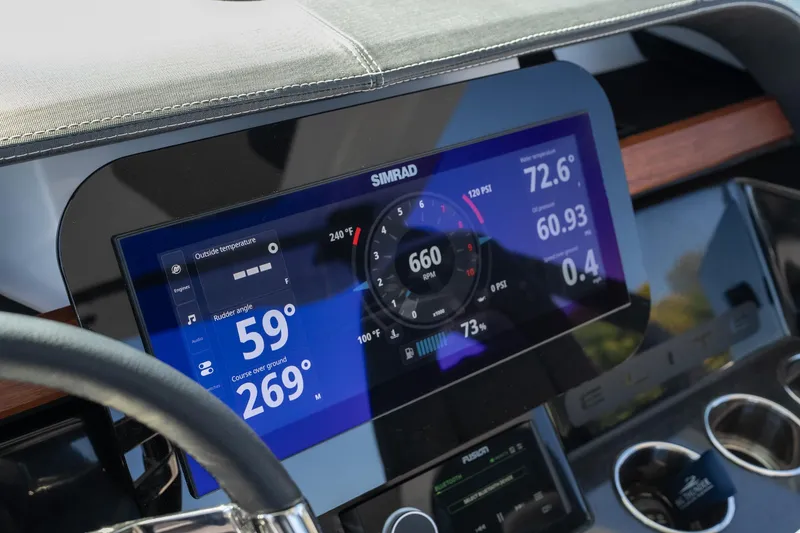 Slide: The Image of Dashboard of 2026 Monterey Elite 27 SD boat with digital display and controls. - 12