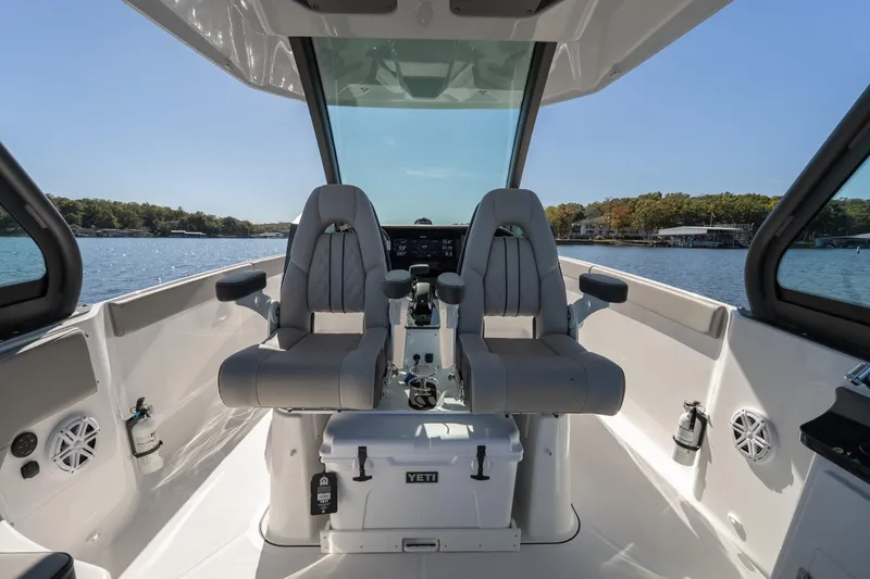 Slide: The Image of Interior view of 2026 Monterey Elite 27 SD boat with dual captain seats. - 14