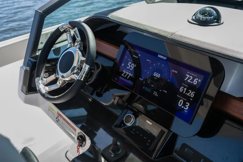 Slide: The Image of 2026 Monterey Elite 27 SD dashboard with advanced digital display and steering wheel. - 19