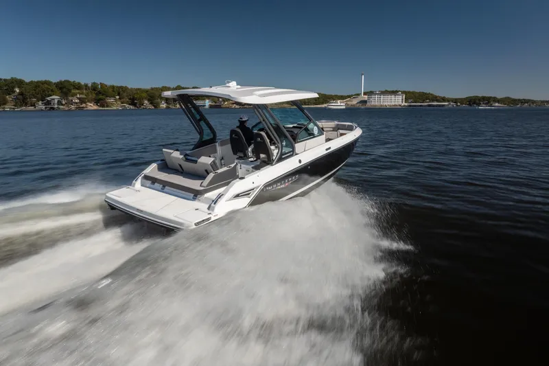 Slide: The Image of 2026 Monterey Elite 27 SD boat cruising on a lake under clear blue skies. - 3