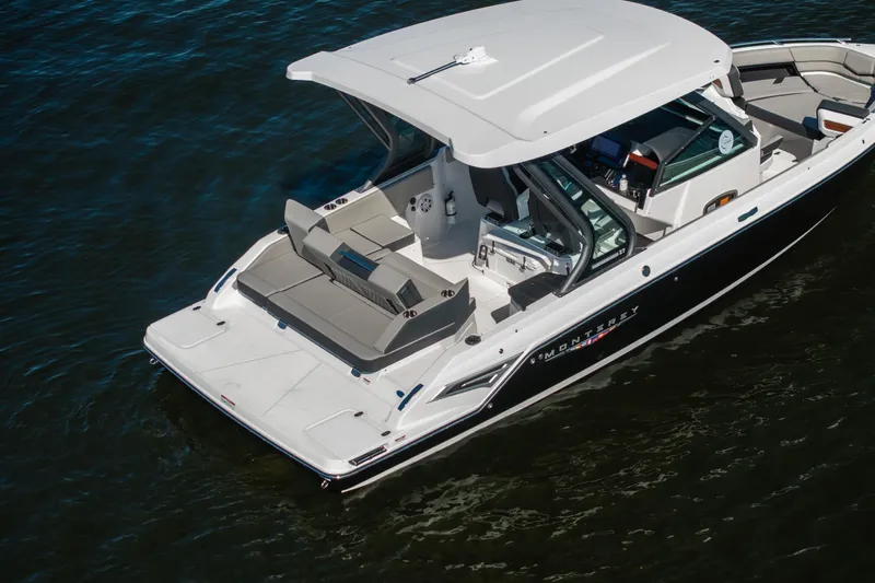 Slide: The Image of 2026 Monterey Elite 27 SD boat on water, featuring sleek design and spacious seating. - 40