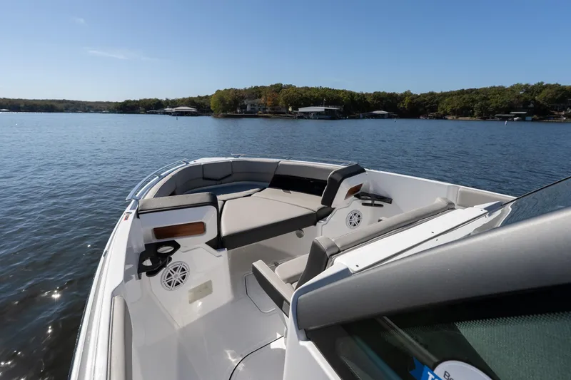 Slide: The Image of 2026 Monterey Elite 27 SD boat on a serene lake with clear skies. - 9