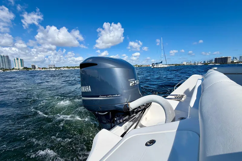 Slide: The Image of 2023 Tidewater 232 LXF boat with Yamaha 250 engine on open water, clear sky. - 22