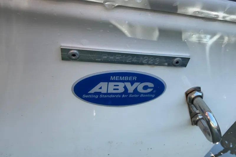 Slide: The Image of 2023 Tidewater 232 LXF boat with ABYC member sticker and identification plate. - 30