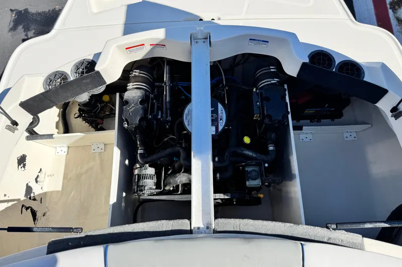 Slide: The Image of 2006 Bayliner 215 Bowrider engine compartment, showcasing the boat's internal mechanics. - 18