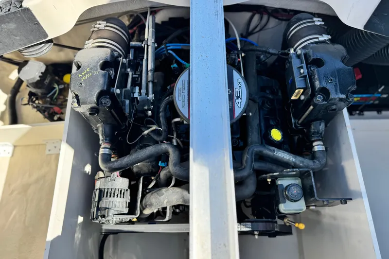 Slide: The Image of Engine compartment of a 2006 Bayliner 215 Bowrider, showcasing the 4.3L V6 engine. - 19