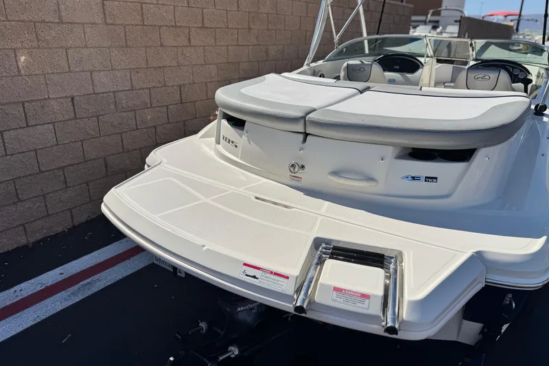 Slide: The Image of 2006 Bayliner 215 Bowrider boat, rear view with swim platform and seating. - 6