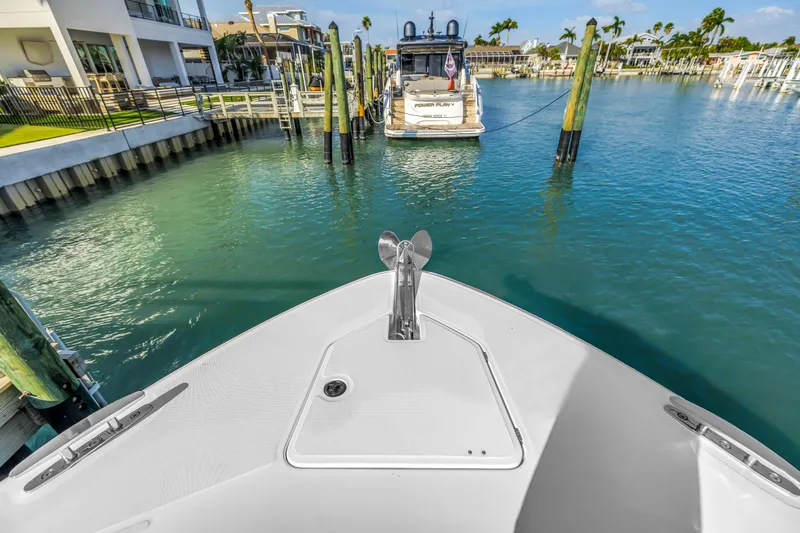 Slide: The Image of Bow view of 2023 HCB 53 Suenos RXV in a marina setting. - 100
