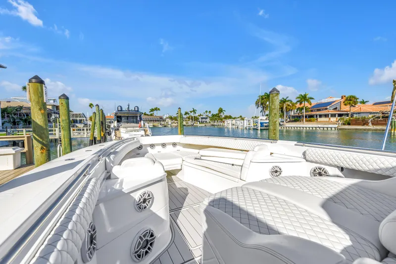 Slide: The Image of 2023 HCB 53 Suenos RXV luxury boat docked in sunny marina setting. - 106