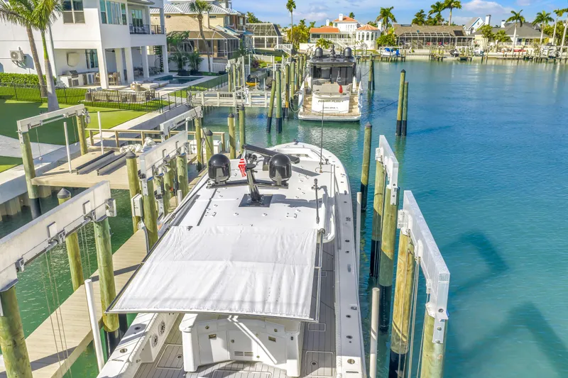 Slide: The Image of 2023 HCB 53 Suenos RXV docked in a scenic waterfront marina. - 11