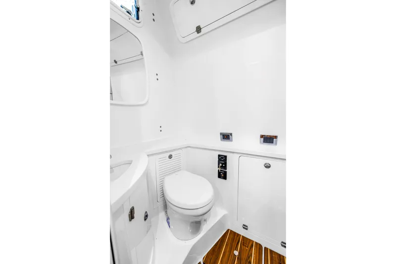 Slide: The Image of Luxurious bathroom in 2023 HCB 53 Suenos RXV boat with modern fixtures and wooden flooring. - 116