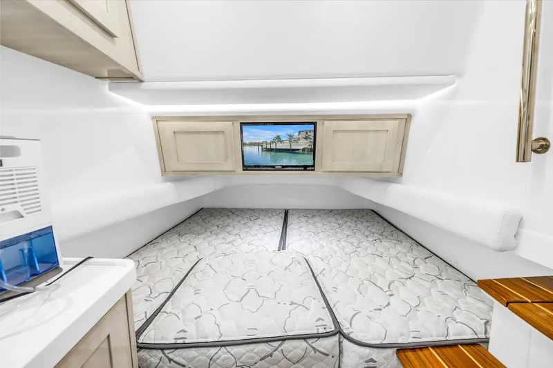 Slide: The Image of 2023 HCB 53 Suenos RXV cabin interior with bed and TV. - 127