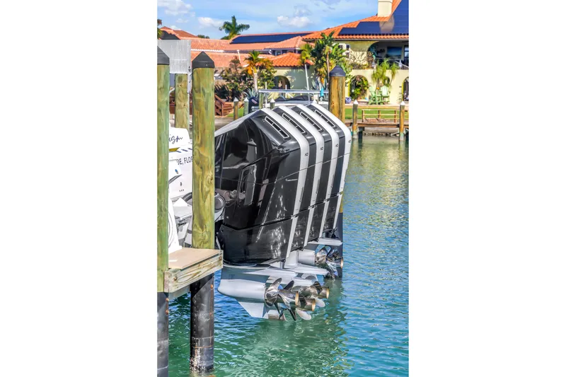 Slide: The Image of 2023 HCB 53 Suenos RXV boat engines docked in marina. - 23