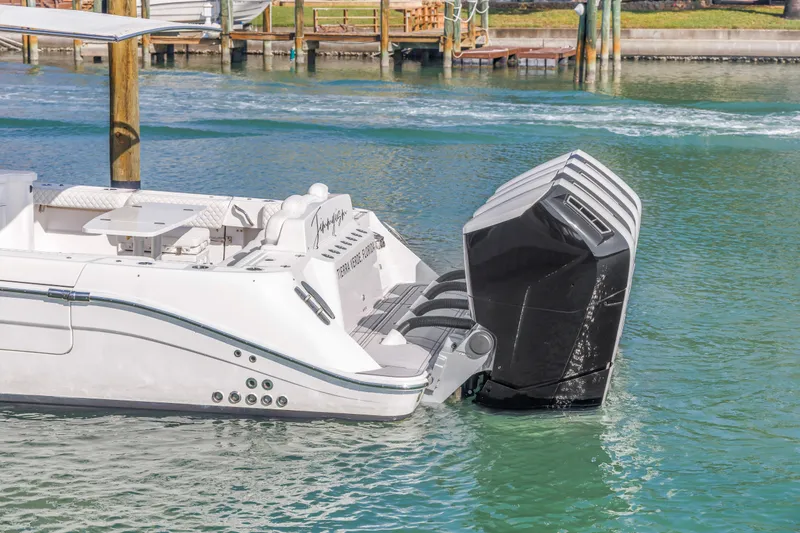 Slide: The Image of 2023 HCB 53 Suenos RXV boat with powerful outboard engines on water. - 26