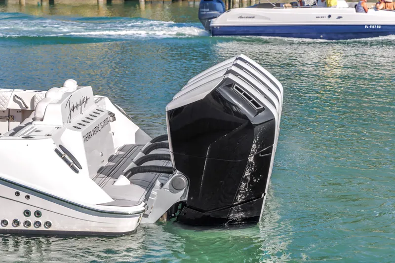 Slide: The Image of 2023 HCB 53 Suenos RXV boat with powerful outboard engines on water. - 28